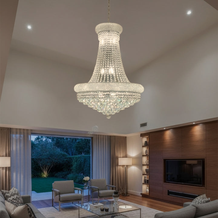 Luxurious chandelier hanging in a modern living room with a TV and decor.