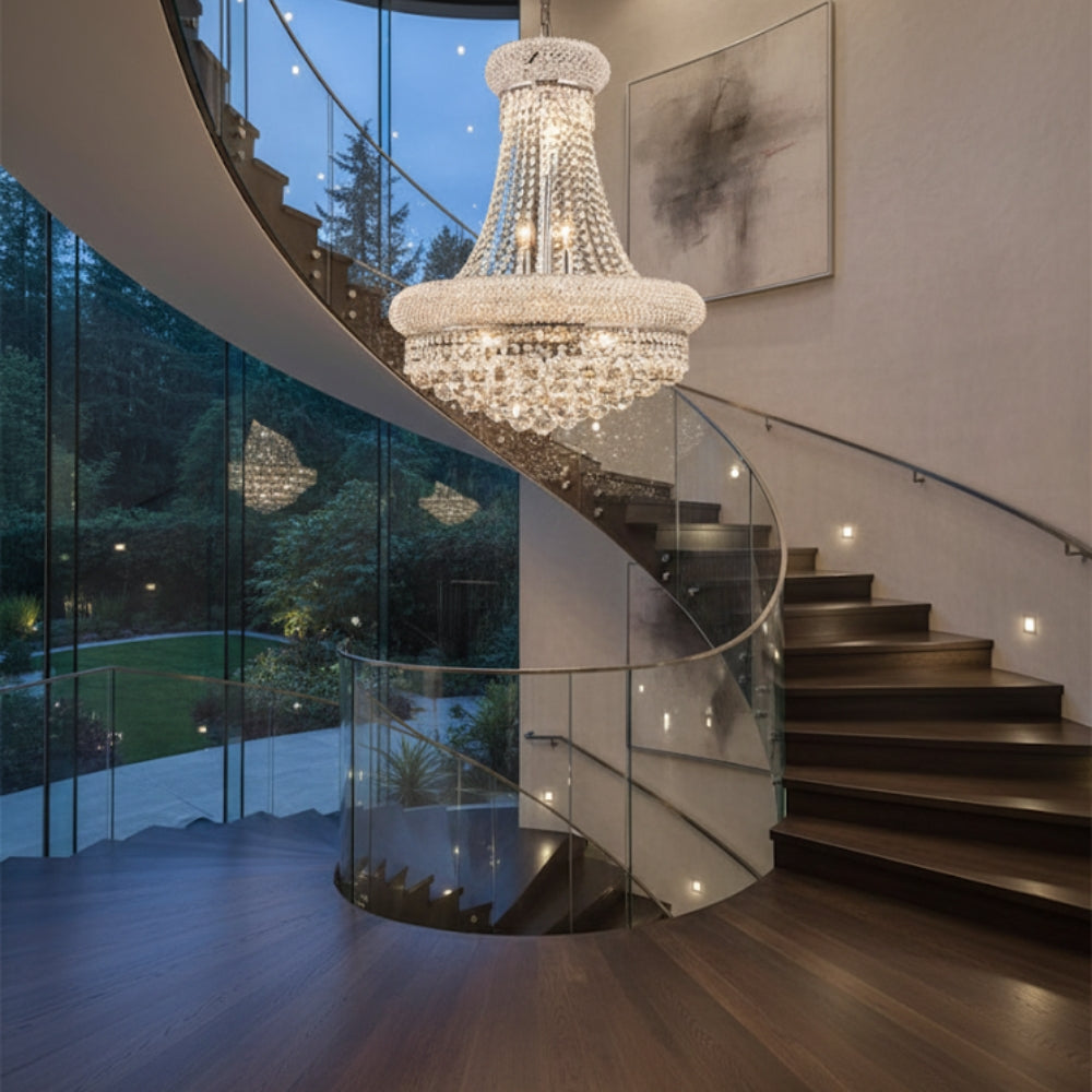Chandelier hanging above a staircase with a glass wall in the background