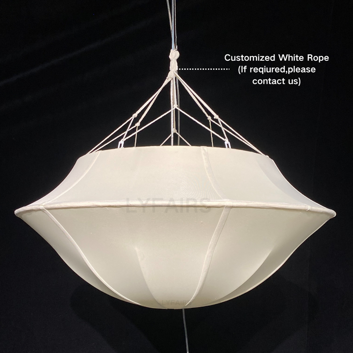 White pendant light with rope suspension on a black background