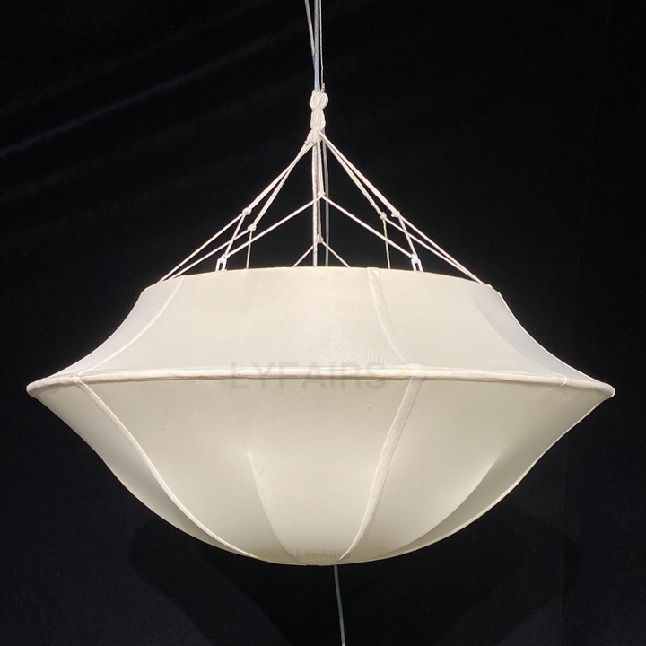 White pendant light with geometric design on a black background