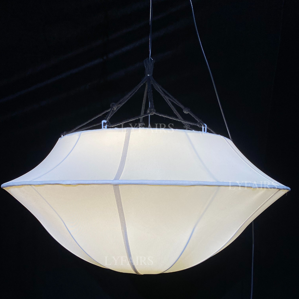 White pendant light fixture against a black background