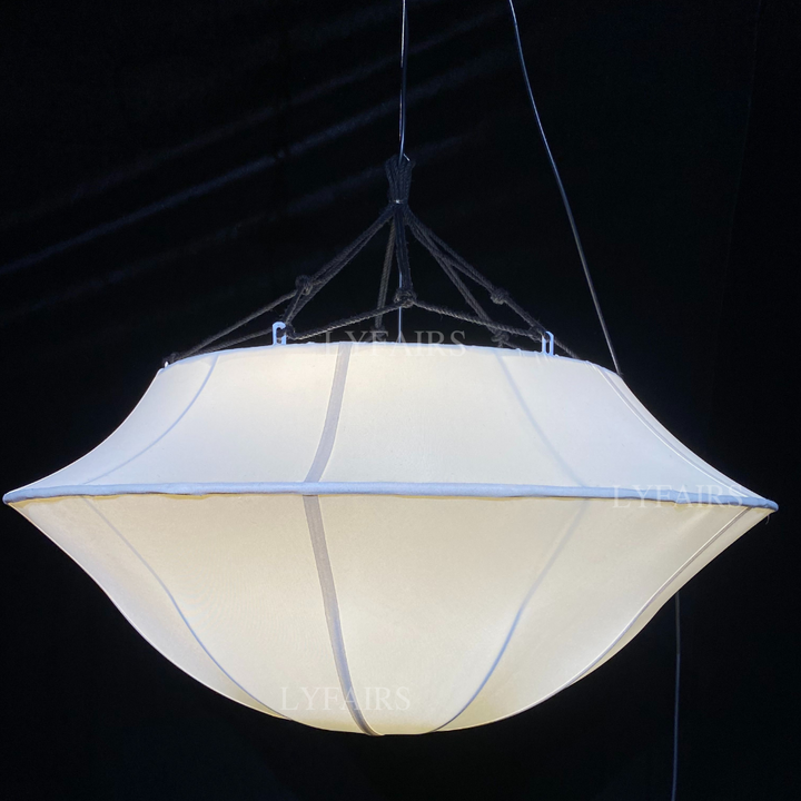 White pendant light fixture against a black background