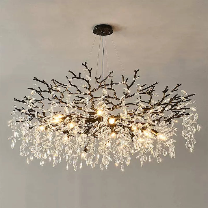 Chandelier with branch-like design on a plain background
