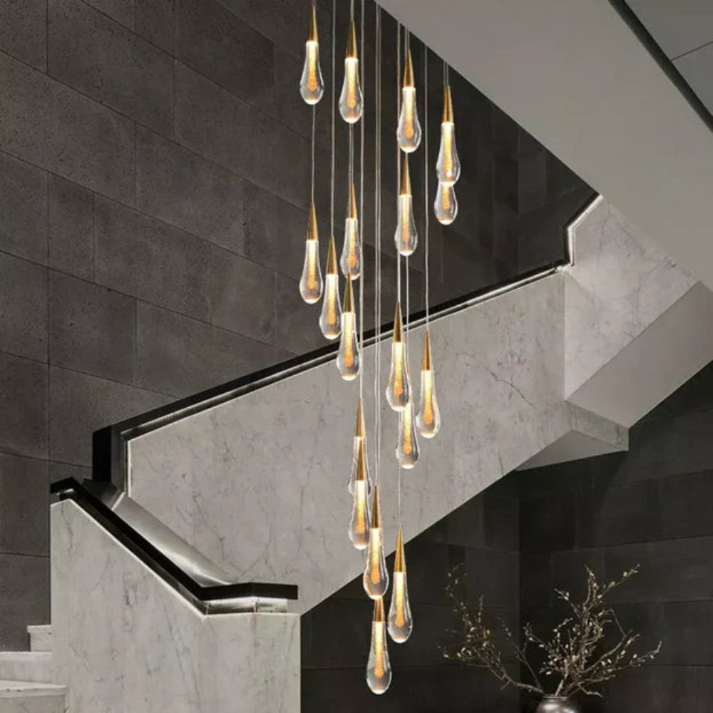 Modern chandelier with hanging light bulbs in a staircase setting