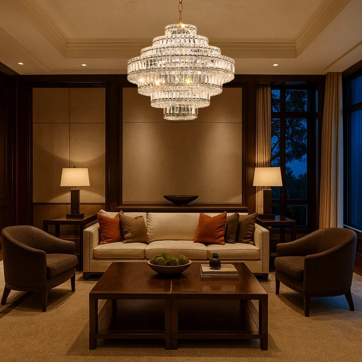 Luxurious living room with a chandelier, sofa, and armchairs.
