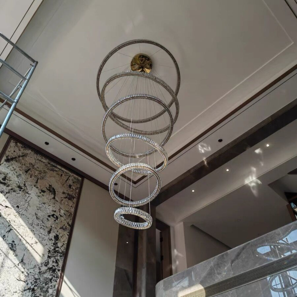 Modern chandelier hanging from a ceiling in a stylish interior setting.