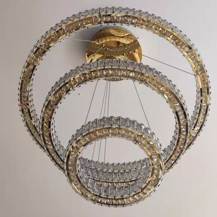 Chandelier with multiple circular rings on a plain background