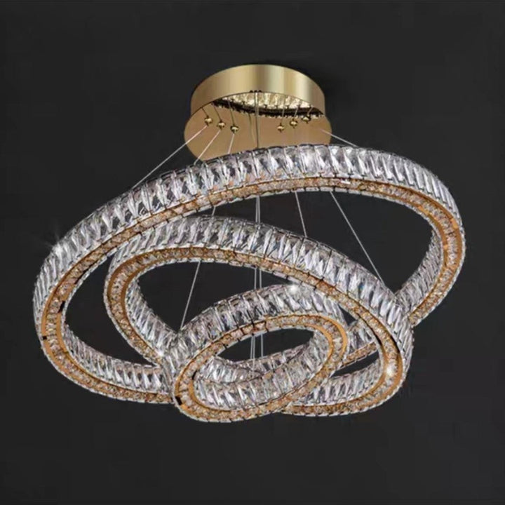 Chandelier with three interlocking rings on a black background