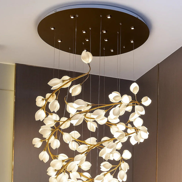 Modern chandelier with leaf-like design hanging from the ceiling.