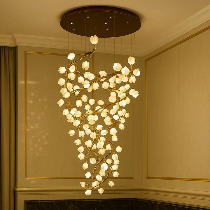 Decorative chandelier hanging in a room with beige walls and a window.