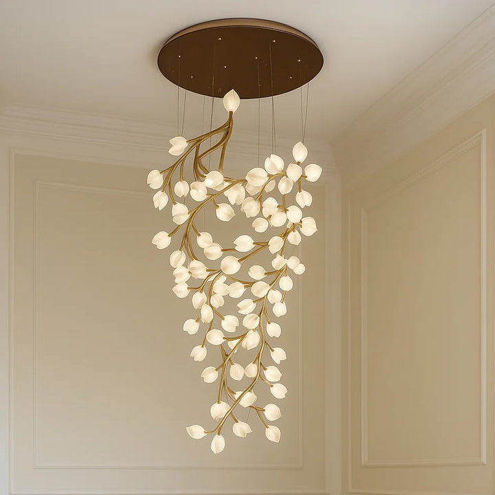 Chandelier hanging from a ceiling in a room with beige walls.