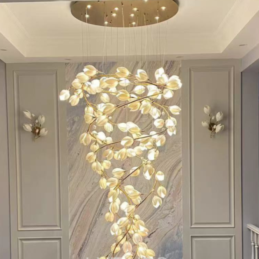 Decorative ceiling light fixture in a room with marble wall and railing.