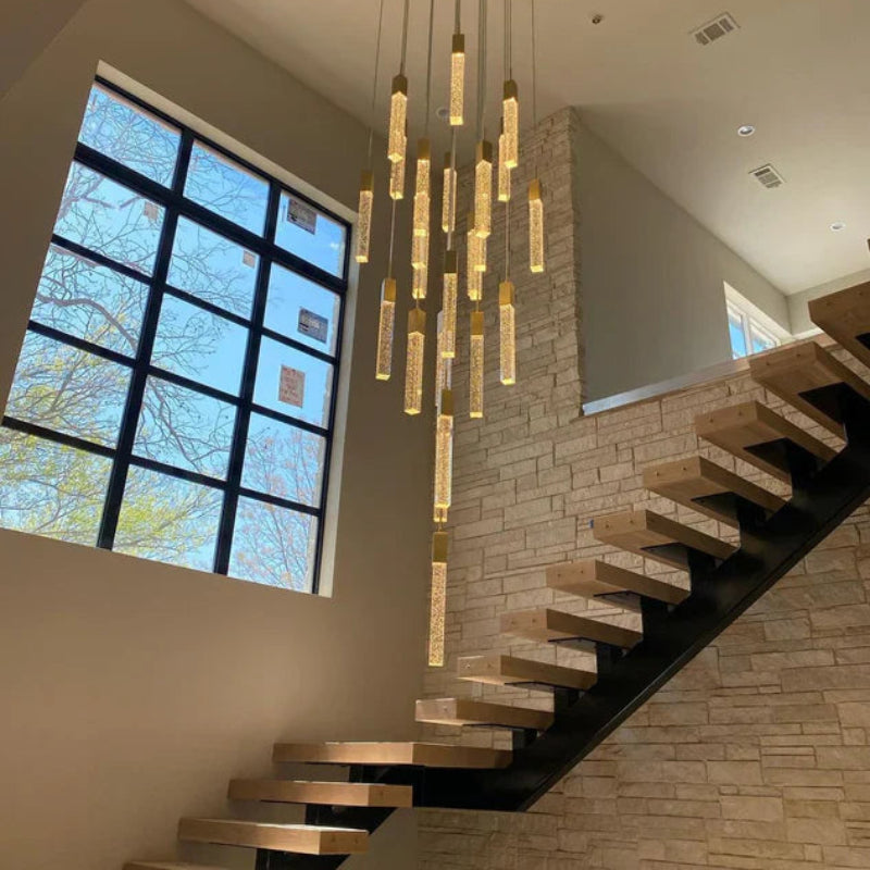Modern Squatu staircase with a decorative ceiling light fixture in a well-lit room.