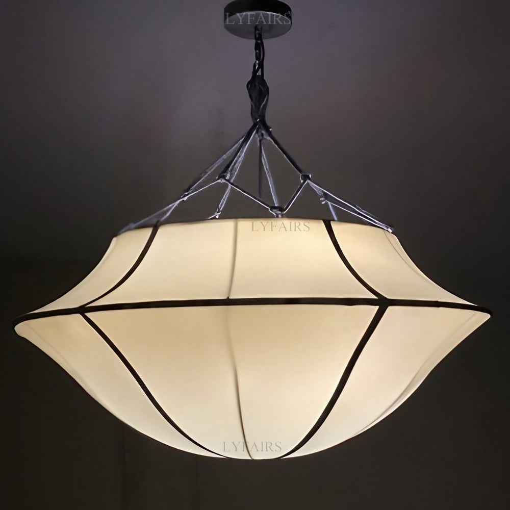 Decorative pendant light with a geometric design on a dark background