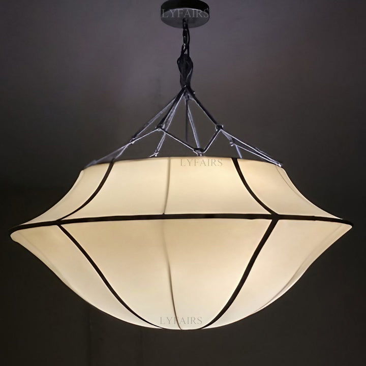 Decorative pendant light with a geometric design on a dark background